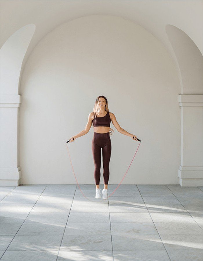 Woman exercising with jump rope